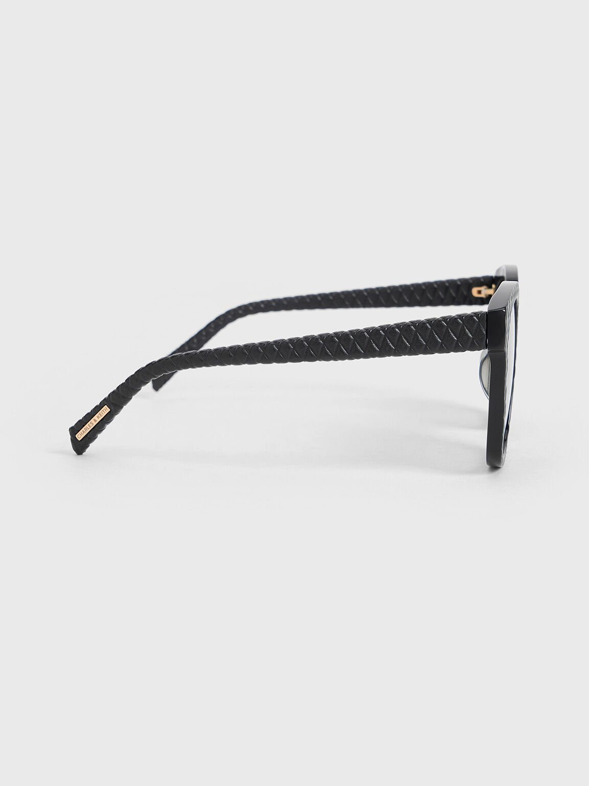 Lunettes de soleil en acétate recyclé et cuir matelassé, Noir, hi-res