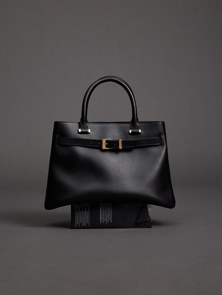 Voyager leather belted trapeze tote bag in black – CHARLES & KEITH