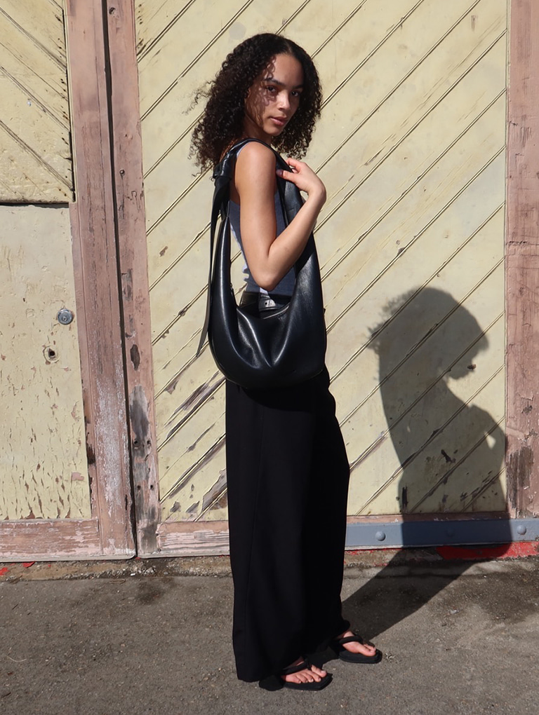 Women’s Toni Knotted Curved Hobo Bag in noir and Tony Puffy-Strap Thong Sandals in black, as seen on Missy James – CHARLES & KEITH