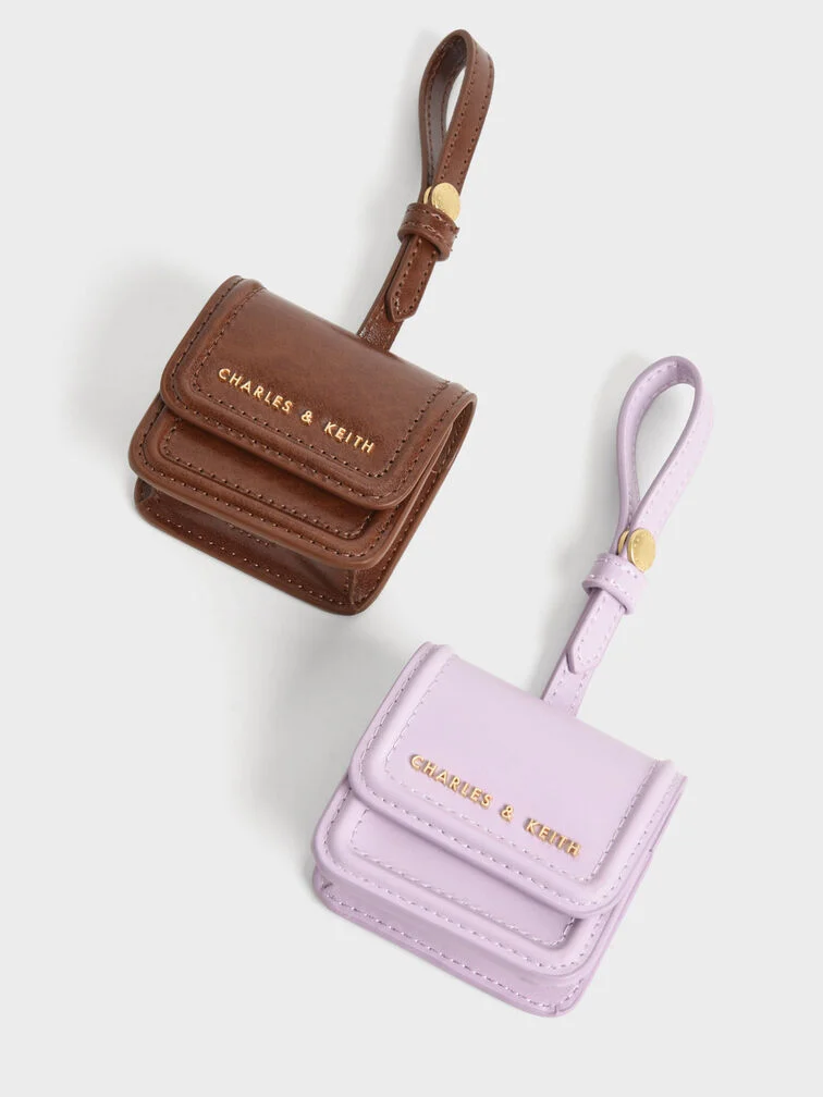 Étui Airpods à surpiqûres en marron foncé et lilas pour femme - CHARLES & KEITH