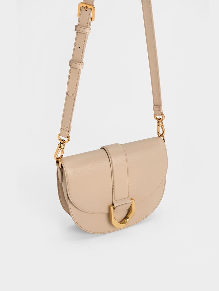 Women's Gabine leather saddle bag in beige - CHARLES & KEITH