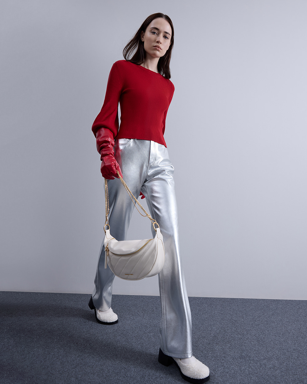 Women’s Philomena Crinkle-Effect Half-Moon Crossbody Bag in cream; Rooney Furry Buckled Block-Heel Mary Janes in white – CHARLES & KEITH