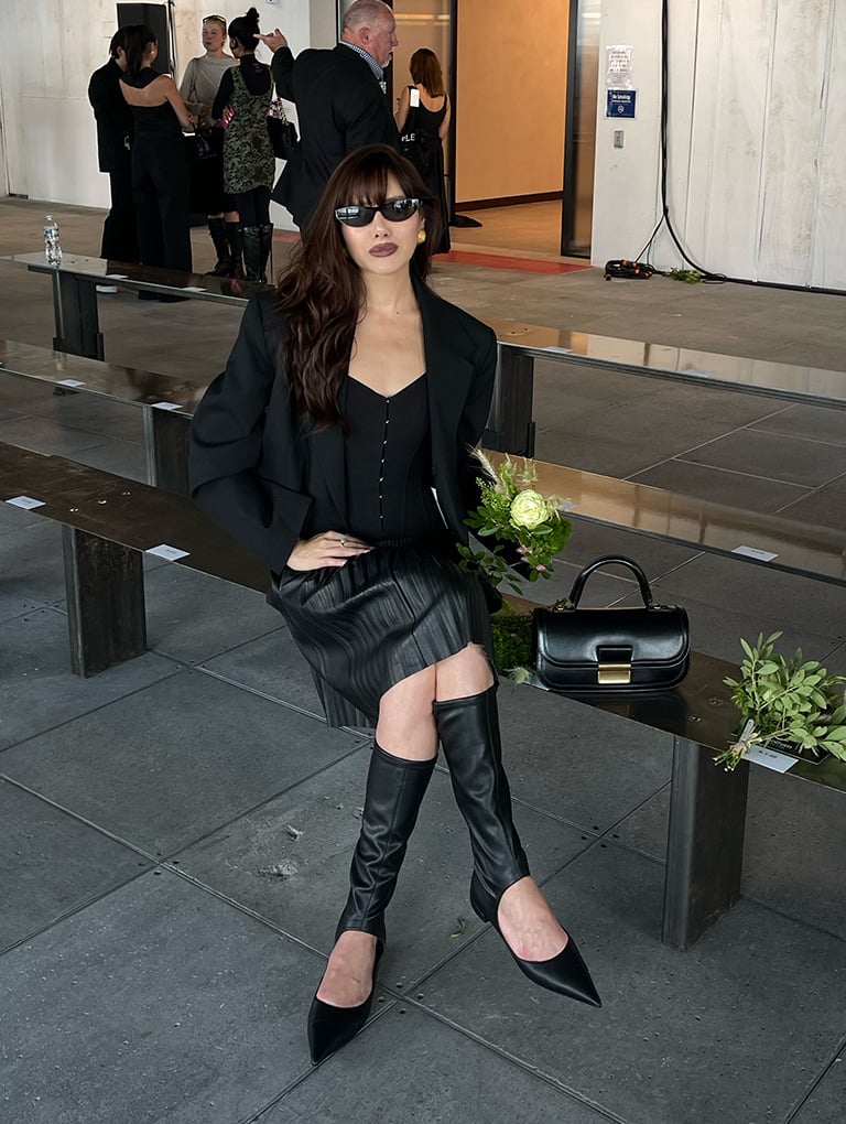 Women’s Charlot elongated top handle bag in black & Robbie cut-out pointed-toe knee-high boots in black, as seen on Natalie Lim Suarez - CHARLES & KEITH