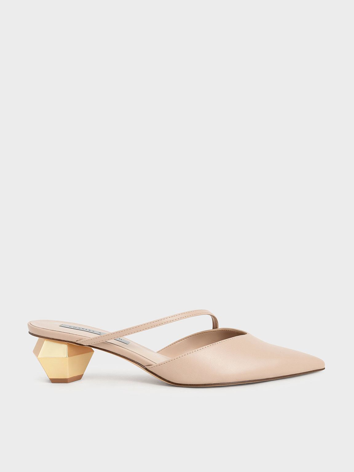 Heeled mules with store asymmetrical straps